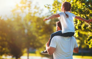 man playing with hi daughter